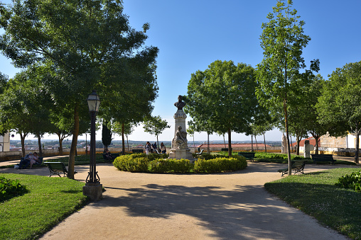 Evora, Portugal - June 2, 2017: The Diana Garden and sculpture of the doctor Barahona in Evora. Popular tourist destination in central Portugal
