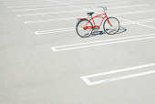 Bike in empty parking lot.