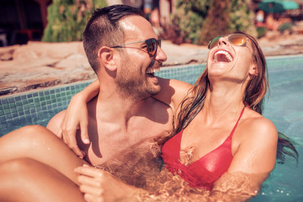 istock Couple having fun in swimming pool 836684876