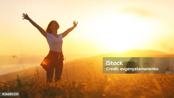 Happy Woman On Sunset In Nature Iwith Open Hands Stock Photo - Download Image Now - Women, Wellbeing, One Woman Only