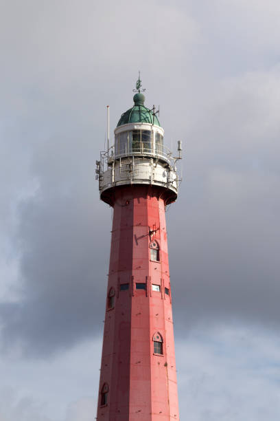 istock Close up of lighthouse tower on cloudy sky background 836685690