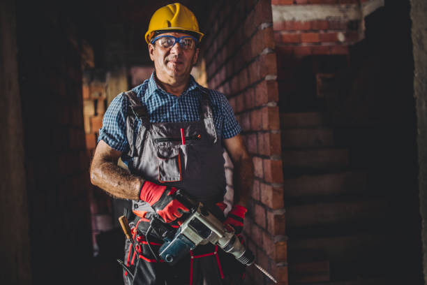 istock Portrait of a man on construction site with drill 836692608