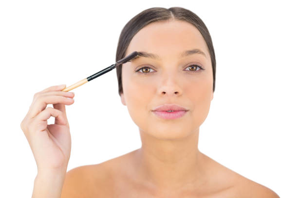 istock Woman brushing her eyebrow 836695466