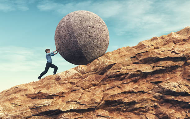 istock Business man pushing large stone 836698788