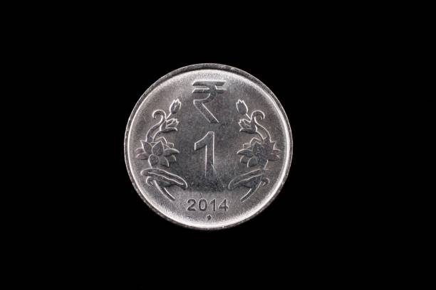 istock Indian one rupee coin close up on black 836698918