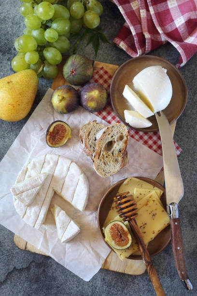 istock Goat cheese, fruits, mozzarella and bread 836704378