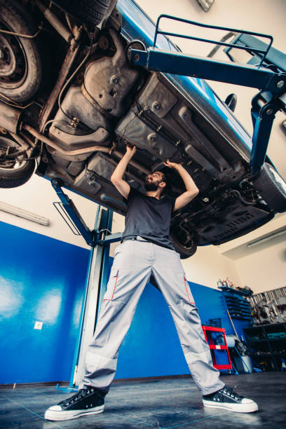 istock Car mechanic working under a vehicle 836709088