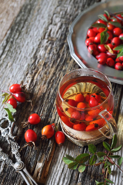 istock Rose hip tea in glass cup and berries 836716024