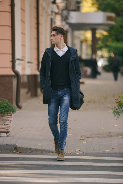 istock Hipster guy walking down the street, urban style 836723350