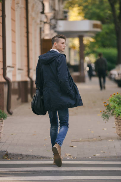 istock Hipster guy walking down the street, urban style 836723388