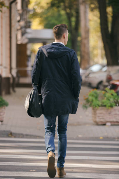 istock Hipster guy walking down the street, urban style 836723640