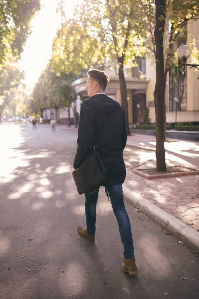 istock Hipster guy walking down the street, urban style 836725916