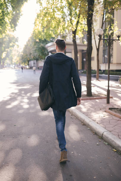 istock Hipster guy walking down the street, urban style 836726880