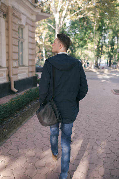 istock Hipster guy walking down the street, urban style 836726984
