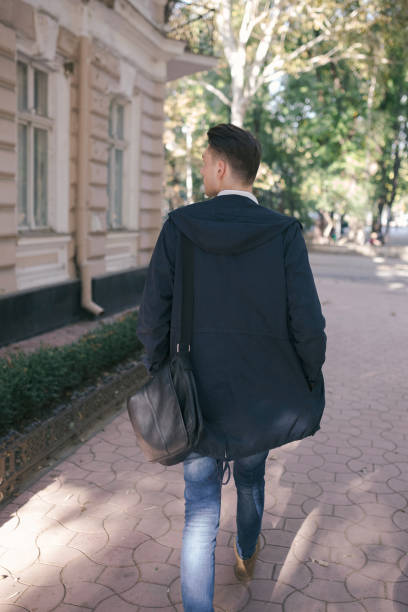 istock Hipster guy walking down the street, urban style 836727126