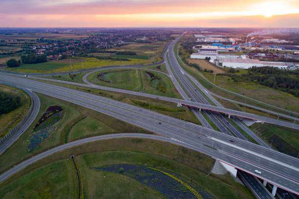 istock Sunset over the highway junction and industrial zone 836767364