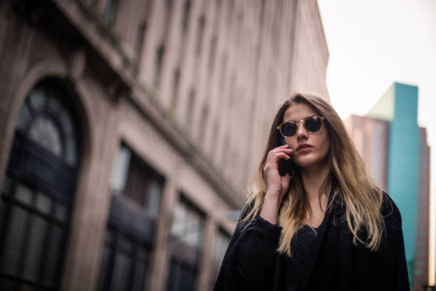 istock Woman using phone on the street 836786970
