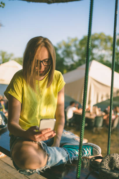 istock Cute girl using cellphone with river in the background, 836792836
