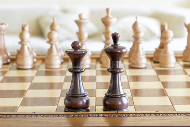istock Wooden chess figures on a wooden chessboard 836792840