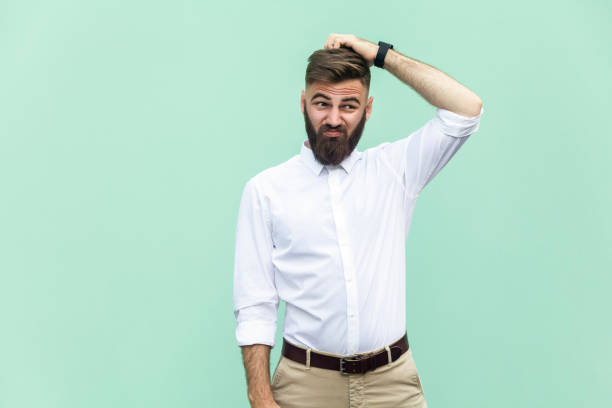 Not sure. Young adult businessman have a doubt. Not sure. Young adult businessman have a doubt. stressed man funny stock pictures, royalty-free photos & images