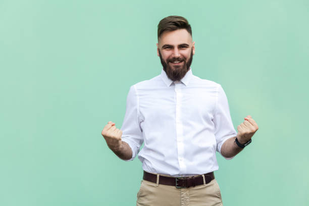 istock Businessman rejoicing for his success. Isolated on light green background. 836798308