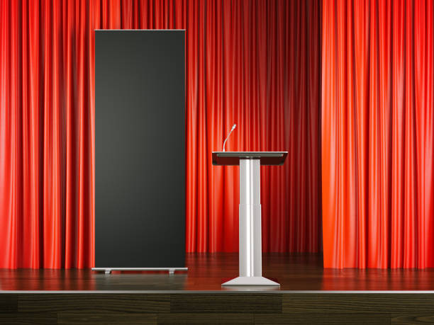istock Tribune and black rollup banner on red stage. 3d rendering 836811902