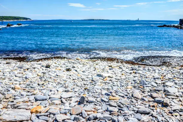Rocky public beach called Ship Cove by Portland Head Lighthouse in Cape Elizabeth, Maine