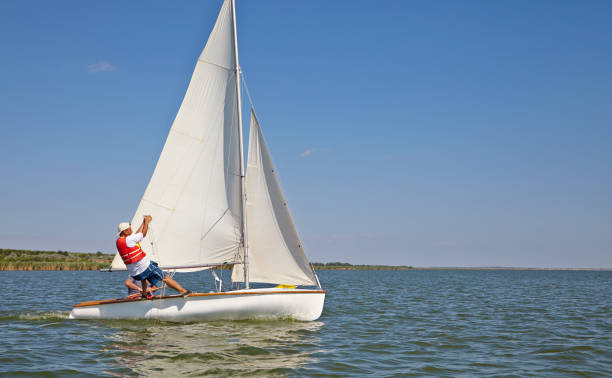 istock Two man drive a sport sailing yacht in competition 836849432
