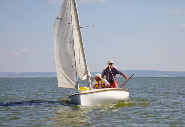 istock Two man drive a sport sailing yacht in competition 836849484