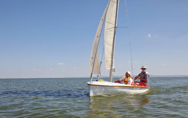 istock Two man drive a sport sailing yacht in competition 836849502