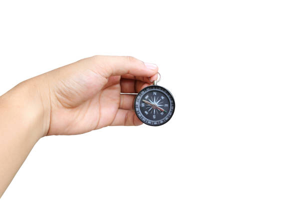 istock Hand of a man holding a compass on white background and have clipping paths to easy deployment. 836851696