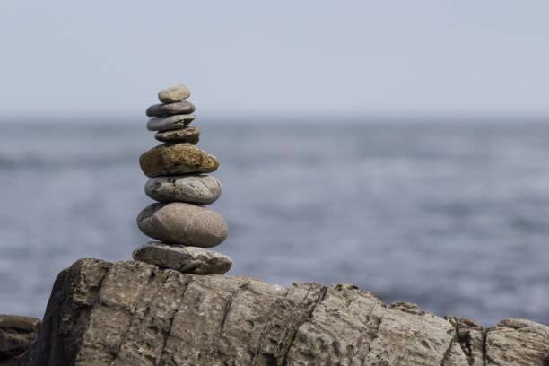 istock Close-Up of Stacked Rocks - Cairn 836858960