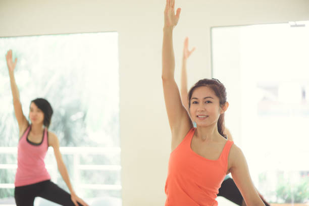 istock Young women yoga indoors keep calm and meditates while practicing yoga to explore the Inner Peace. Yoga and meditation have good benefits for health. Photo concept for Yoga Sport and Healthy lifestyle 836870798