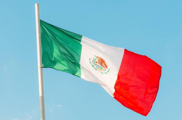 istock Waving colorful Mexico flag on blue sky 836884254