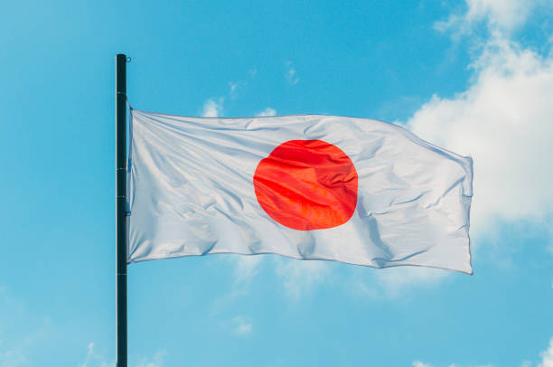 istock Waving colorful Japan flag on blue sky 836884280