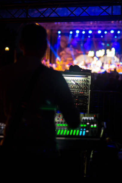 Sound technician at music festival DJ at music festival sound technician stock pictures, royalty-free photos & images