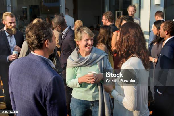 Diverse People Standing Talking Outdoor Stock Photo - Download Image Now - Community, Meeting, Business