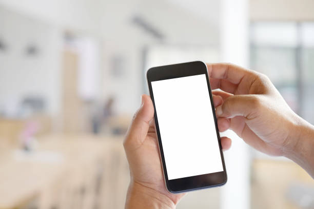 istock Man hands holding blank screen a smartphone and blurred background. 836916086