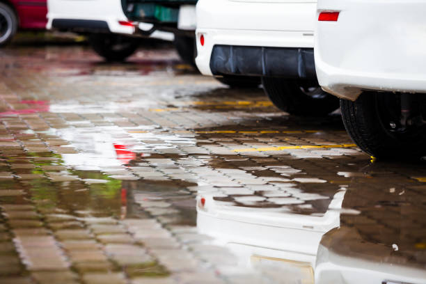 istock Car park with water on ground in raining day 836923282