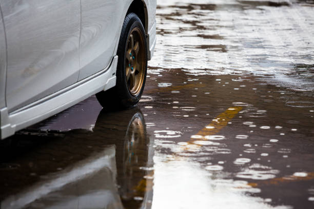 istock Car park with water on ground in raining day 836923758