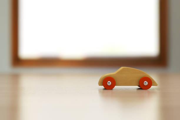 istock Wooden toy car on the table. 836926628