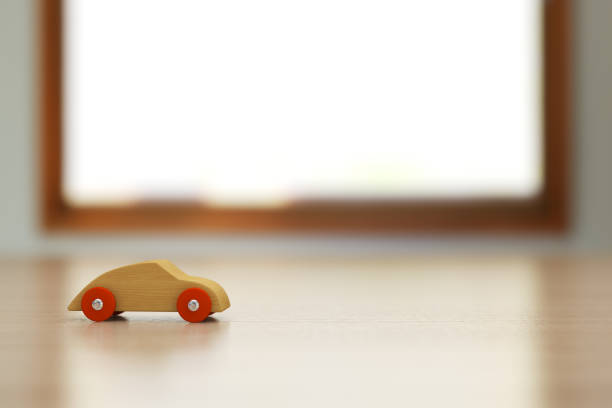 istock Wooden toy car on the table. 836926666