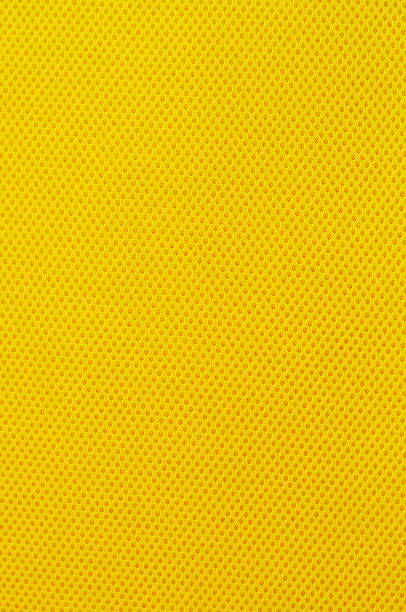 Air Mesh Air Mesh and a fabric used in the manufacture of Bags, Sneakers, Backpacks, Jackets and Caps. mustard yellow fabric stock pictures, royalty-free photos & images
