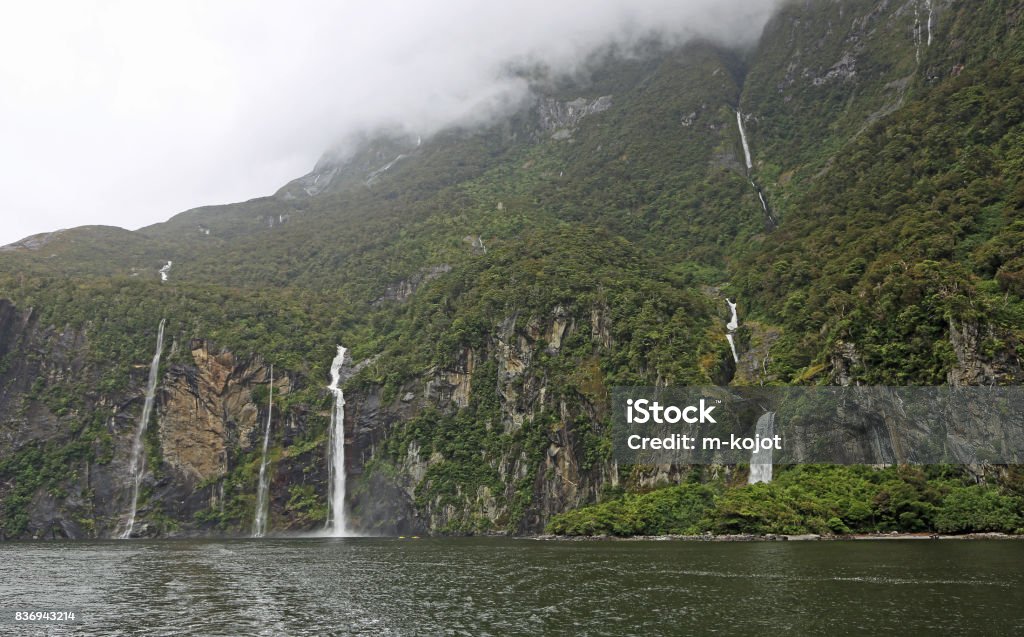 Cliffs with Fairy Falls Fiordland National Park, New Zealand Beauty Stock Photo