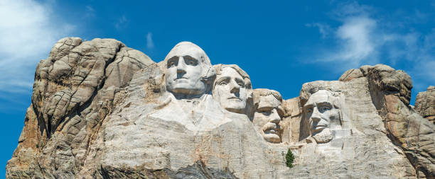 Mount Rushmore Panorama A panorama of the four presidents of the United States carved at Mount Rushmore national monument: Washington, Jefferson, Roosevelt and Lincoln. Located in the Black Hills near Rapid City in South Dakota, USA. black hills national forest stock pictures, royalty-free photos & images