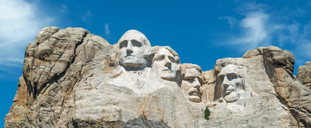 Mount Rushmore Panorama A panorama of the four presidents of the United States carved at Mount Rushmore national monument: Washington, Jefferson, Roosevelt and Lincoln. Located in the Black Hills near Rapid City in South Dakota, USA. theodore roosevelt us president stock pictures, royalty-free photos & images