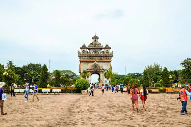 Photo of Patuxay or Patuxai park at night with illuminated Gate of Victory is famous landmark in Vientiane, Laos.