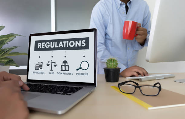 istock REGULATIONS and COMPLIANCE Rules Law professionals businessman working concept 836991100