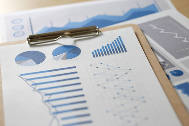 istock Business reports  Teamwork on table report  of documents Blue graphs and charts financial paperwork and reportsà¸ 836991320
