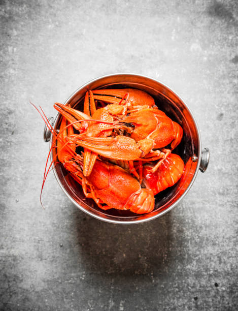 Boiled crawfish in a steel bucket.